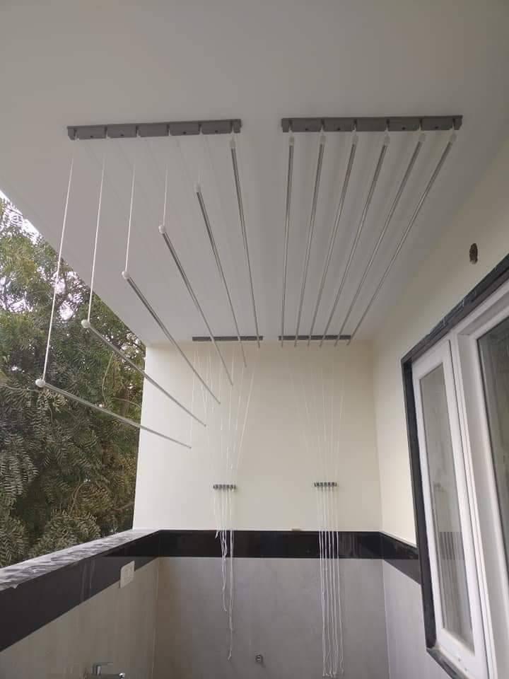 EverDry ceiling cloth hanger installed on an apartment balcony